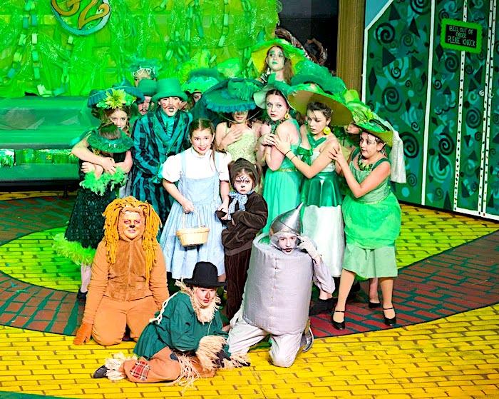 PPA students who are dressed in costume and performing the Wizard of Oz  gather together on the Yellow Brick Road.