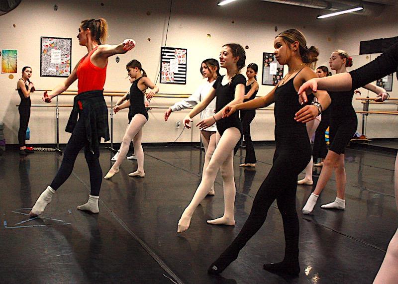 Parker Performing Arts teacher Courtland Peterson leads a ballet class for middle school dancers.